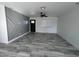 Living room with gray accent wall and tile floors at 819 E Erie St, Chandler, AZ 85225