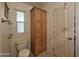 Clean bathroom with toilet, linen cabinet, and tile floor at 8700 E University Dr # 545, Mesa, AZ 85207