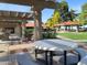 Relaxing patio area with pergola, tables, and benches at 8700 E University Dr # 545, Mesa, AZ 85207