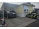 Home exterior features carport, golf cart, and landscaping at 8700 E University Dr # 545, Mesa, AZ 85207
