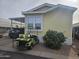 Exterior of yellow single wide home with golf cart at 8700 E University Dr # 545, Mesa, AZ 85207
