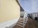 Mobile home exterior with steps leading to a deck at 8700 E University Dr # 545, Mesa, AZ 85207