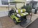 Green golf cart with white seats and upgraded rims at 8700 E University Dr # 545, Mesa, AZ 85207