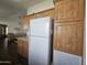 Spacious kitchen with wood cabinets, stainless steel appliances, and tile flooring at 8700 E University Dr # 545, Mesa, AZ 85207