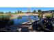 Serene pond with golf course and golf cart in background at 8700 E University Dr # 545, Mesa, AZ 85207
