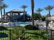Community pool with lounge chairs and a clubhouse at 8700 E University Dr # 545, Mesa, AZ 85207
