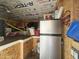 Storage shed interior with mini-fridge and shelving at 8700 E University Dr # 545, Mesa, AZ 85207