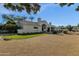 Back exterior view of a single-story house with a manicured lawn at 9512 E Altadena Ave, Scottsdale, AZ 85260