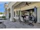 Covered patio with seating area and view into the home at 9512 E Altadena Ave, Scottsdale, AZ 85260