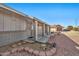 Brick home's front entrance with covered porch and landscaping at 11121 W Mirandy Ct, Sun City, AZ 85351