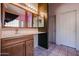 Bathroom with double vanity and access to other rooms at 12926 W Bloomfield Rd, El Mirage, AZ 85335