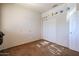 Simple bedroom with carpet, double door closet, and window coverings at 12926 W Bloomfield Rd, El Mirage, AZ 85335