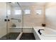 Modern bathroom with a large walk-in shower and soaking tub at 13126 E La Junta Rd, Scottsdale, AZ 85255