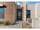 Stylish entryway with a modern door and stone accents at 13126 E La Junta Rd, Scottsdale, AZ 85255