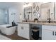 Elegant bathroom featuring double vanity and soaking tub at 1322 W Flower St, Phoenix, AZ 85013