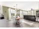 Open dining area with hardwood floors and natural light at 15049 W Alexandria Way, Surprise, AZ 85379