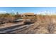 Desert landscape with a view of the home at 15405 E Cavedale Dr, Scottsdale, AZ 85262