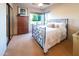 Bedroom with a metal bed frame and built-in wooden storage at 15405 E Cavedale Dr, Scottsdale, AZ 85262