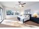 Primary bedroom with large windows and a ceiling fan at 15405 E Cavedale Dr, Scottsdale, AZ 85262