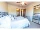 Bedroom with a metal bed frame and mirrored closet doors at 15405 E Cavedale Dr, Scottsdale, AZ 85262