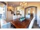 Bright dining room featuring a large table and chandelier at 15405 E Cavedale Dr, Scottsdale, AZ 85262