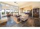 Spacious living room with a fireplace and large windows offering natural light at 15405 E Cavedale Dr, Scottsdale, AZ 85262