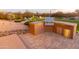 Built-in outdoor kitchen with grill and refrigerator at 15405 E Cavedale Dr, Scottsdale, AZ 85262