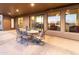 Covered patio with seating area and views into the home at 15405 E Cavedale Dr, Scottsdale, AZ 85262