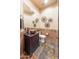Stylish powder room with copper sink and dark wood vanity at 15405 E Cavedale Dr, Scottsdale, AZ 85262