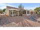 Backyard view of house, showing landscaping and rock features at 15708 W Whitewood Dr, Sun City West, AZ 85375