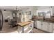 Kitchen with white cabinets, granite countertops, and kitchen island at 15949 N Cristine Ln, Surprise, AZ 85388