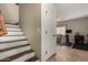 Staircase with wooden steps and white risers at 15949 N Cristine Ln, Surprise, AZ 85388