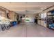 Two-car garage with ample storage space and shelving at 18019 N 137Th N Dr, Sun City West, AZ 85375