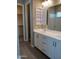 Modern bathroom with double vanity, large mirror, and walk-in shower at 21026 E Calle Luna Ct, Queen Creek, AZ 85142