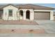 Newly constructed one-story home with a two-car garage and desert landscaping at 21026 E Calle Luna Ct, Queen Creek, AZ 85142