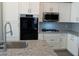 Spacious kitchen featuring granite countertops and stainless steel appliances at 21026 E Calle Luna Ct, Queen Creek, AZ 85142