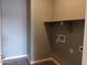 Convenient laundry room with hookups and shelving at 21026 E Calle Luna Ct, Queen Creek, AZ 85142