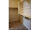 Spacious walk-in closet with ample shelving and hanging rods at 21026 E Calle Luna Ct, Queen Creek, AZ 85142