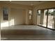 Bright and airy living room with tile floors and sliding glass doors at 21039 E Poco Calle St, Queen Creek, AZ 85142