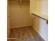 Spacious walk-in closet with hanging rods and shelving at 21039 E Poco Calle St, Queen Creek, AZ 85142