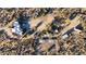Aerial view showcasing a sprawling desert property with a main house and outbuildings at 26639 N 132Nd St, Scottsdale, AZ 85262