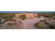 Desert property with a large stucco home and a long driveway at 26639 N 132Nd St, Scottsdale, AZ 85262
