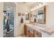 Bathroom with double vanity and wood cabinets at 26639 N 132Nd St, Scottsdale, AZ 85262