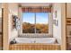 Relaxing bathroom with mountain views and a large soaking tub at 26639 N 132Nd St, Scottsdale, AZ 85262