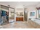 Spacious bathroom featuring a walk-in shower, soaking tub, and double vanity at 26639 N 132Nd St, Scottsdale, AZ 85262