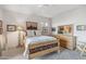 Bedroom with wooden bed frame and western-themed decor at 26639 N 132Nd St, Scottsdale, AZ 85262