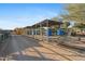 Metal-roofed corral stalls with feed bins at 26639 N 132Nd St, Scottsdale, AZ 85262