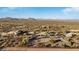 Aerial view of horse corrals with covered shelters and water troughs at 26639 N 132Nd St, Scottsdale, AZ 85262