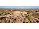 Aerial view of a large stucco home with a three-car garage and desert landscaping at 26639 N 132Nd St, Scottsdale, AZ 85262