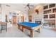 Game room with pool table, fireplace and views into entryway at 26639 N 132Nd St, Scottsdale, AZ 85262